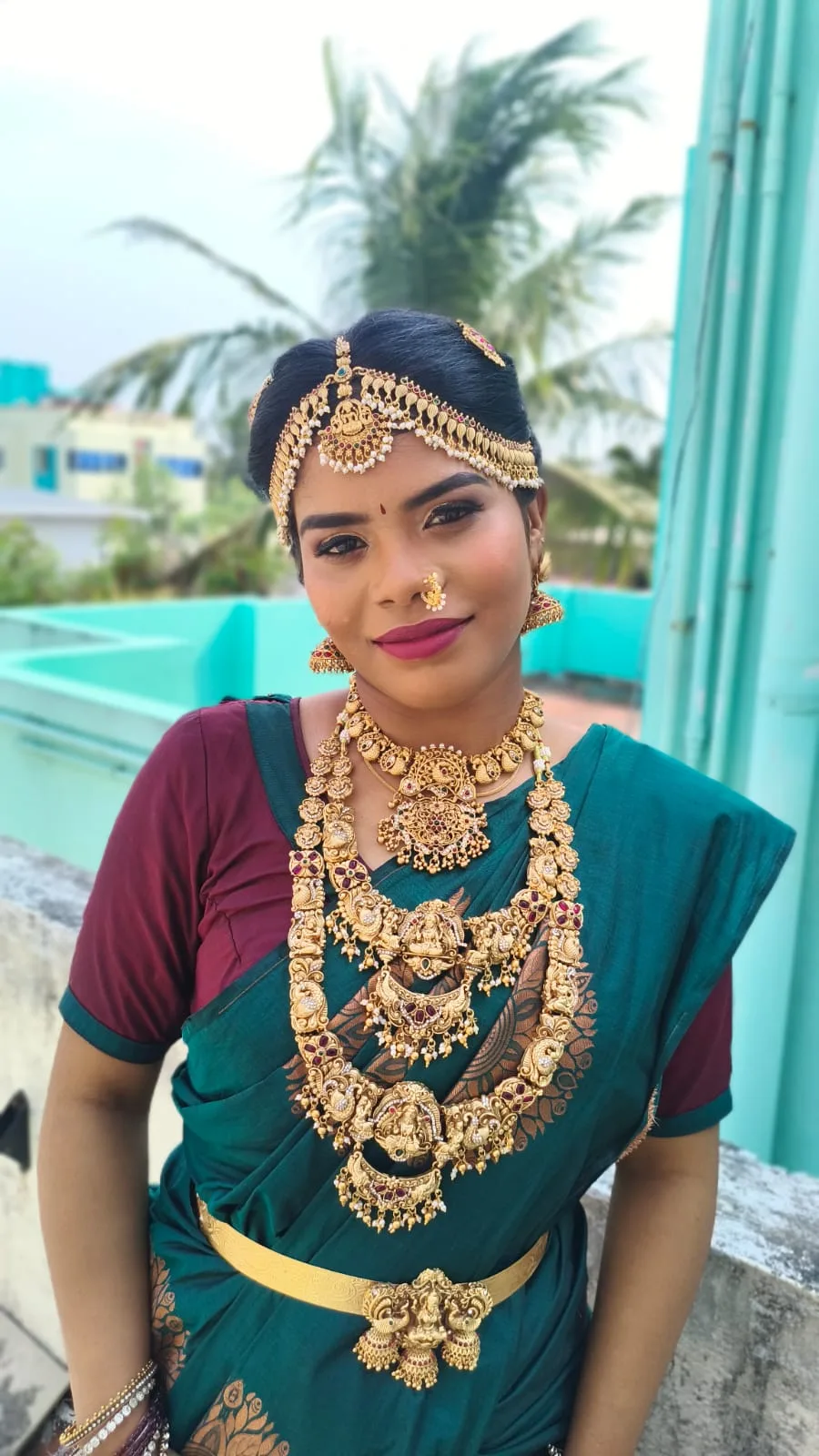 Full-length bridal portrait in red outfit
